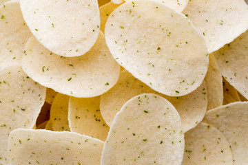 Close up potato chips on wood top view background.