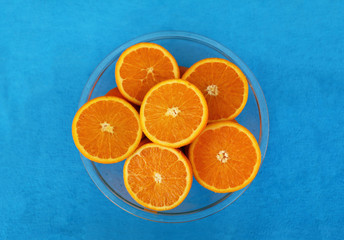 Six halves of oranges in glass bowl arranged in the form of flower