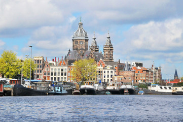 Fototapeta premium View of Amsterdam with houses built on canals 