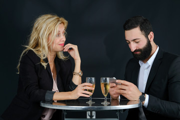 Young attractive business couple man with black beard and blond