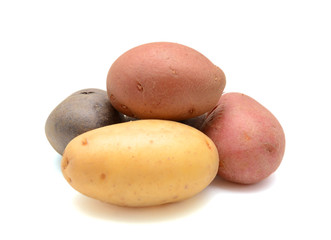 Mixed varieties of potatoes: red potatoes, yellow potatoes and purple potatoes