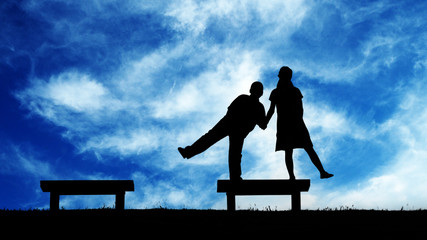 Obraz premium Children action in silhouette with background blue sky and white cloud