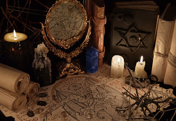 Magic mirror, demon paper and blue crystal, Halloween background