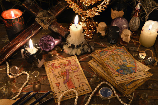 Mystic ritual with tarot cards, magic objects and candles