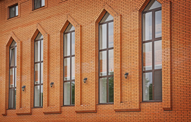 Facade of brick building with lancet windows