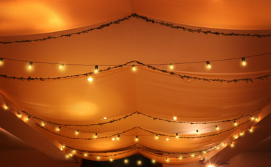 Vintage lamps and floral garland decoration