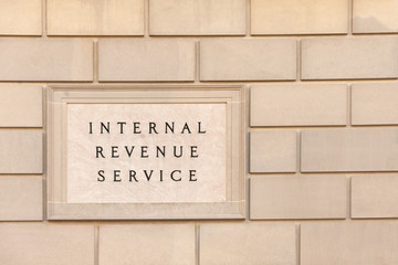 Sign on IRS headquarter building in downtown Washington, DC
- 131610852