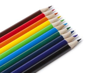 Colored Pencils in order of rainbow on white background