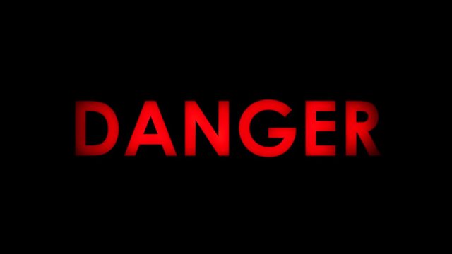 Danger - Red flashing warning message text on black background. Two speeds. Seamlessly loopable. 4K.
