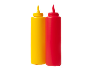 Catsup and Mustard condiment bottles in red and yellow, isolated over white.