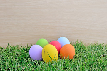 Colorful easter eggs on green grass