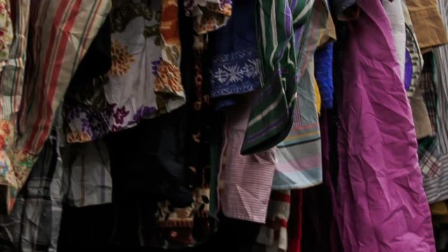 View of Racks with Colorful Women Clothes in Shop