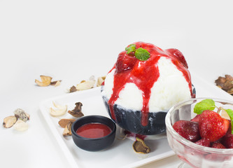 Shaved ice with milk, chocolate, white malt and strawberry sauce