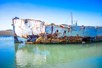 abandoned fishing and shrimp boat near folly beach south carolin