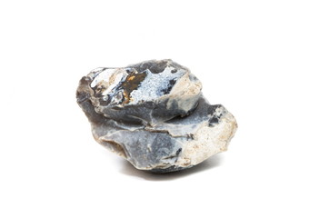 Black flint stone isolated on white background