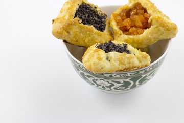 Hamantaschen with poppy seed and sweet pear filling