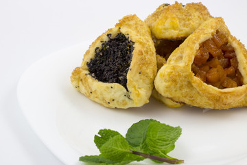 Hamantaschen with poppy seed and sweet pear filling