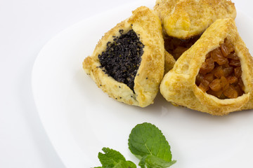 Hamantaschen with poppy seed and sweet pear filling