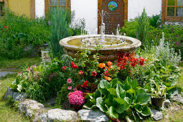 Vase with a decorative fountain in the garden