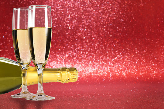 Champagne toast, red background