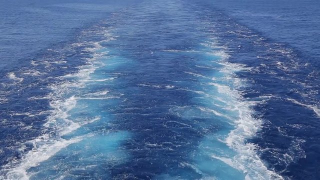 Wake of thecargo ship on water surface.