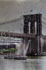 Raindrops on a window looking over the Brooklyn Bridge