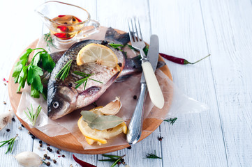 Delicious fresh fish on vintage background.