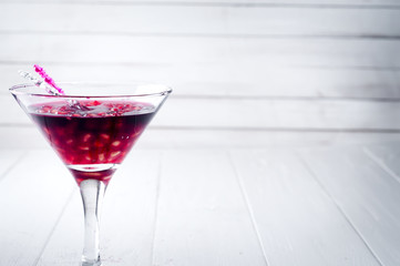 pomegranate cocktail and ripe red fruit