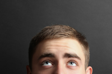 Close up male eyes looking up