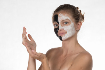 Happy beautiful girl with acne on a white background in a cosmet