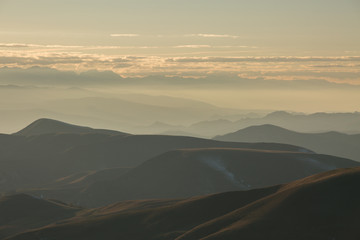 The formation and movement of clouds above the volcano Elbrus in the Caucasus Mountains in winter.