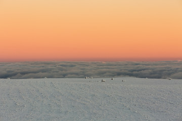 The formation and movement of clouds above the volcano Elbrus in the Caucasus Mountains in winter.