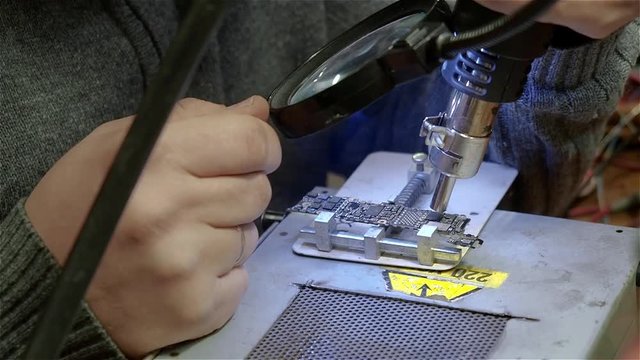 White male setup chips in motherboard smartphone iphone