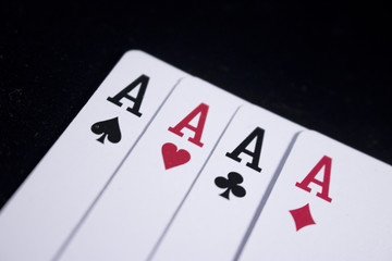 Obraz premium ace four of a kind poker card on dark black background