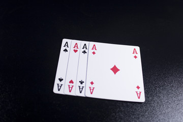 Obraz premium ace four of a kind poker card on dark black background