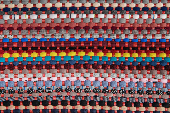 background, texture of colored handmade carpet