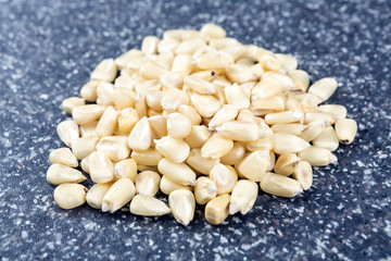 White hominy posole on a mottled grey blue background