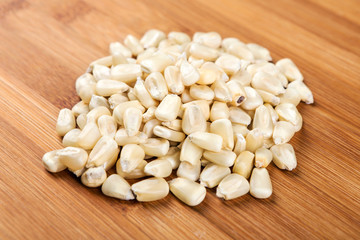 White hominy posole isolated on a wood background