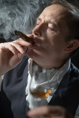Fototapeta premium Man holding a cigar in his mouth