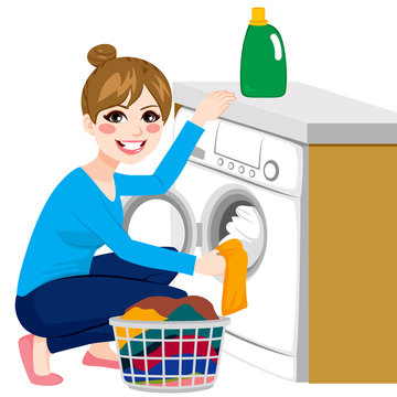 Beautiful young woman doing laundry putting dirty clothes on washing machine from basket