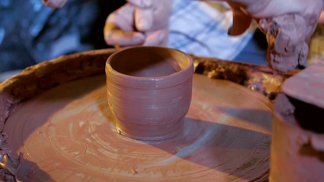Pottery workshop, manufacture of ceramic ware, the removal of the products of the Potter's wheel