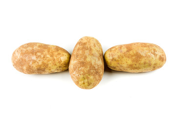 Three potatoes isolated on a white background