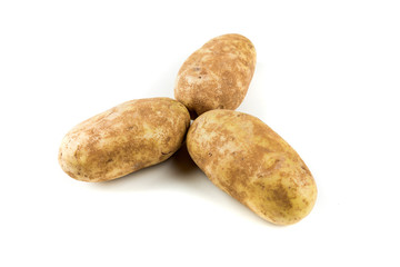 Three potatoes isolated on a white background