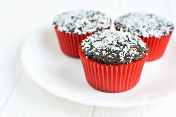 Homemade cupcakes with chocolate glaze and coconut