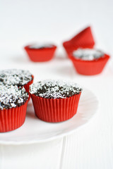 Homemade cupcakes with chocolate glaze and coconut