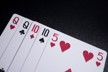 two pairs poker card on dark black background