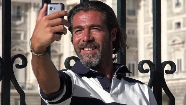 Man Taking Selfies Using Phone