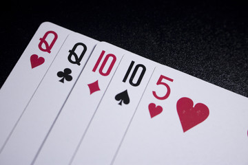 two pairs poker card on dark black background