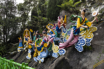Statues of Fairies on clouds, pulling a carriage in which the Heavenly Mother or Wong Mo is seated,...