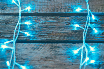 Blue Christmas garland on old boards